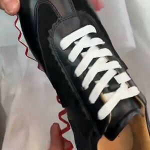 Black Sneakers with Red Sole and White Laces